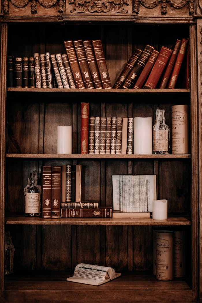 about-01 Vintage books and rustic decor on a wooden bookshelf, perfect for a classic study atmosphere.